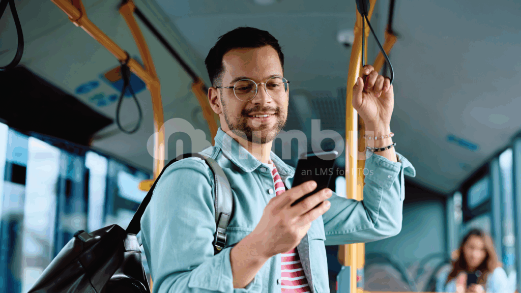 Student accessing mobile learning content on a smartphone while commuting