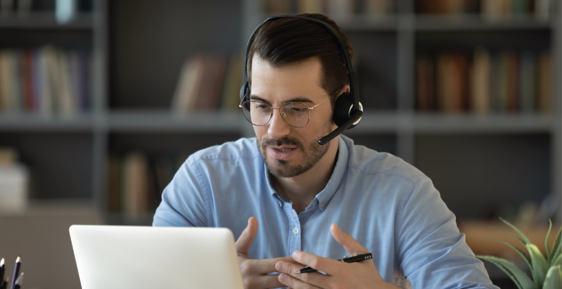 Trainer using online learning technology to support students through a virtual session