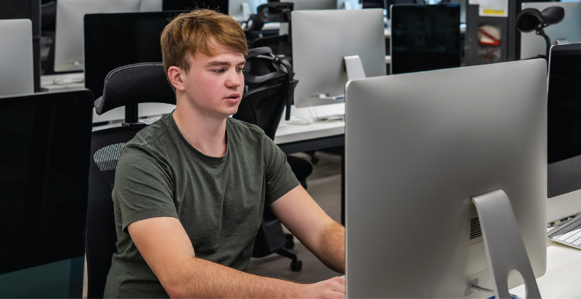 Where Traditional Learning Management Systems Create Friction Student using a desktop computer to access a learning management system