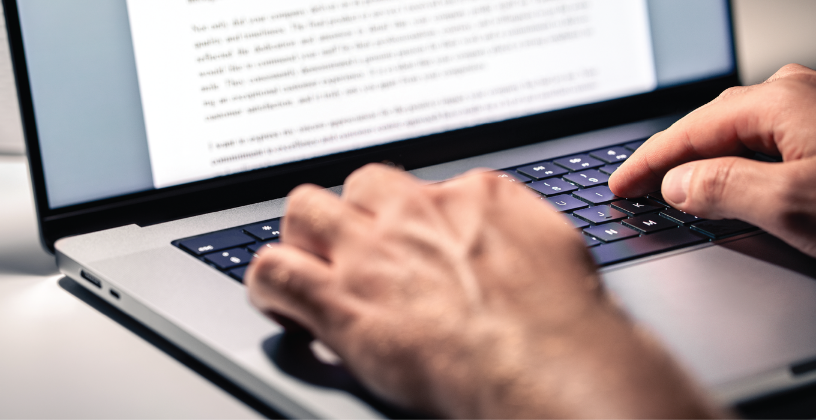 Person creating digital learning content on a laptop.