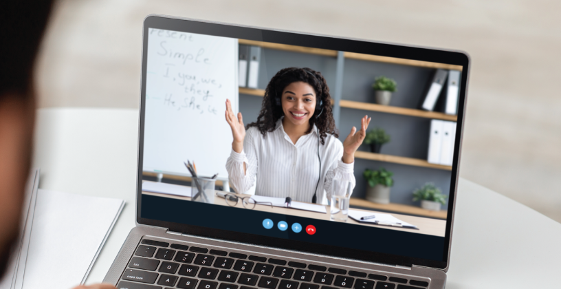 Student attending a live virtual class on a laptop.
