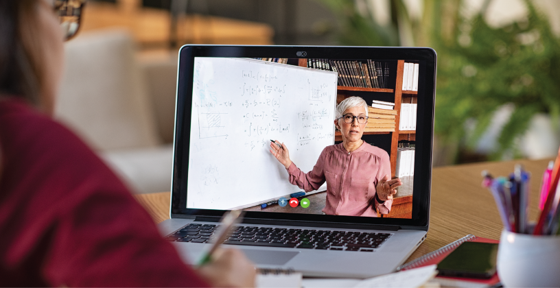 Smarter automation is reducing administrative workload Student attending a live online class with an instructor teaching through video conferencing.