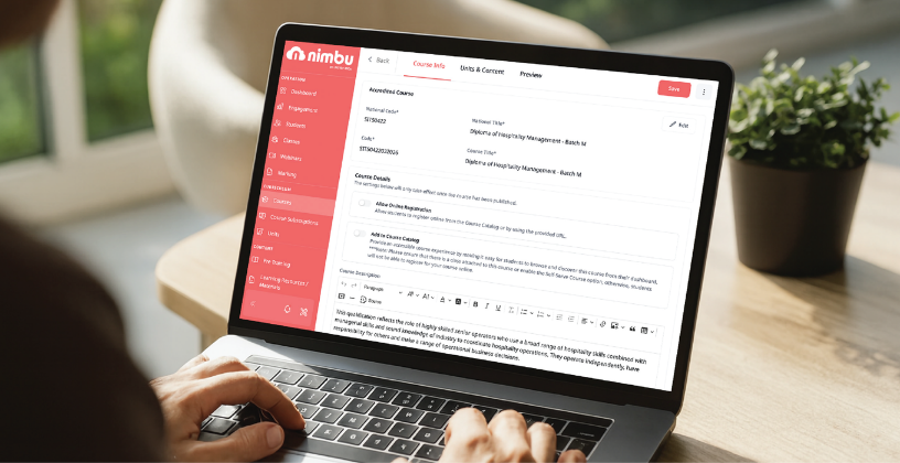 A person focused on a laptop featuring a striking red and white design, engaged in work or browsing.