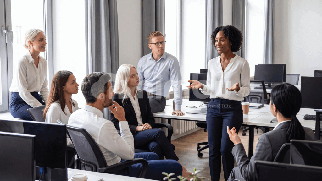 A group of diverse business professionals collaborating in a modern office setting.